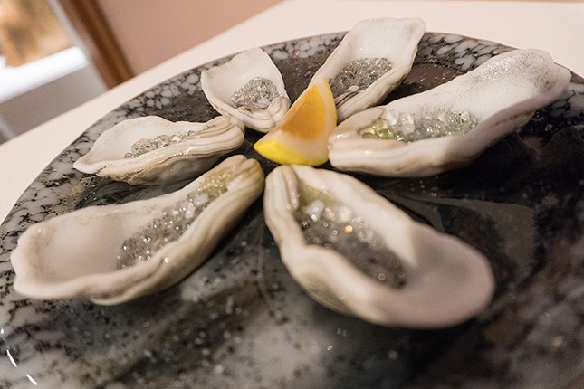 Paula Clancy contributed a plate of oysters and a plate of sushi made of glass to the "You Are What You Eat" exhibit.
    Photo by Jennifer Ring