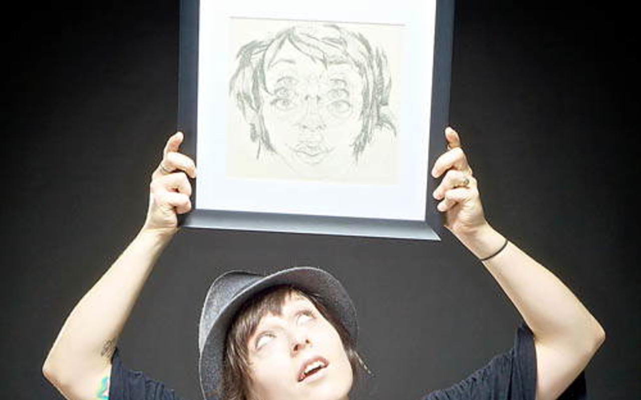 Laura Spencer eyes her self-portrait.
