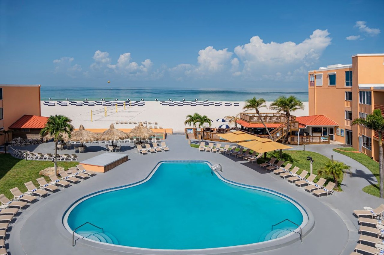 Dolphin Beach Resort
4900 Gulf Blvd, St Pete Beach, 727-360-7011    
$60-$99
For those 21 or older, your Dolphin Beach Resort Day Pass comes with a reserved lounge chair by the pool and access to the beach for $99. Flipper’s Beach Bar offers discounted drinks and snacks, and passholders also get discounts on watersports and lounge chairs. A beach cabana with two lounge chairs is available for $60.
Photo via Dolphin Beach Resort/Google