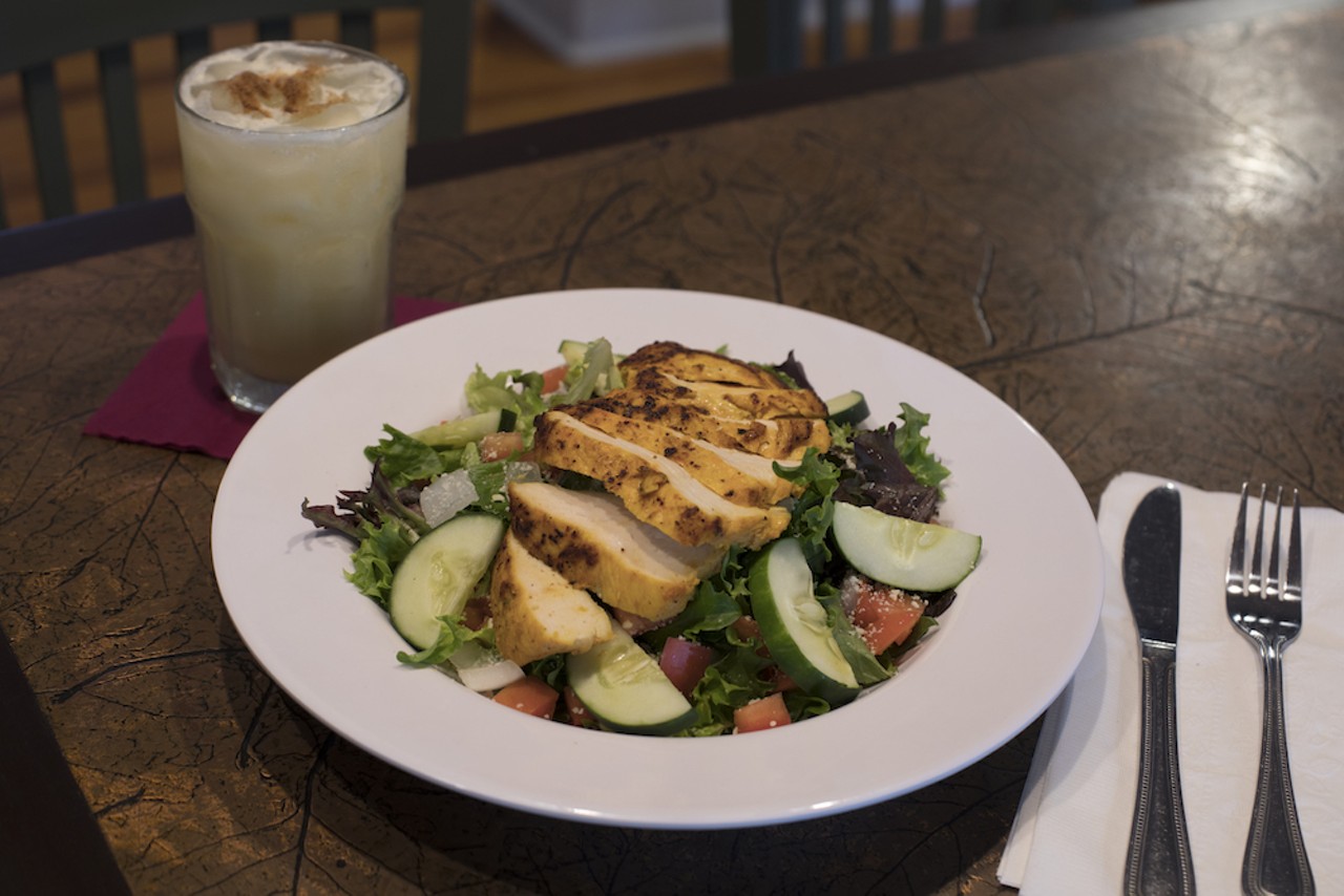 Finished with a choice of dressing, the chicken salad consists of field greens, tomato, cucumber, olives, onions and carrots.