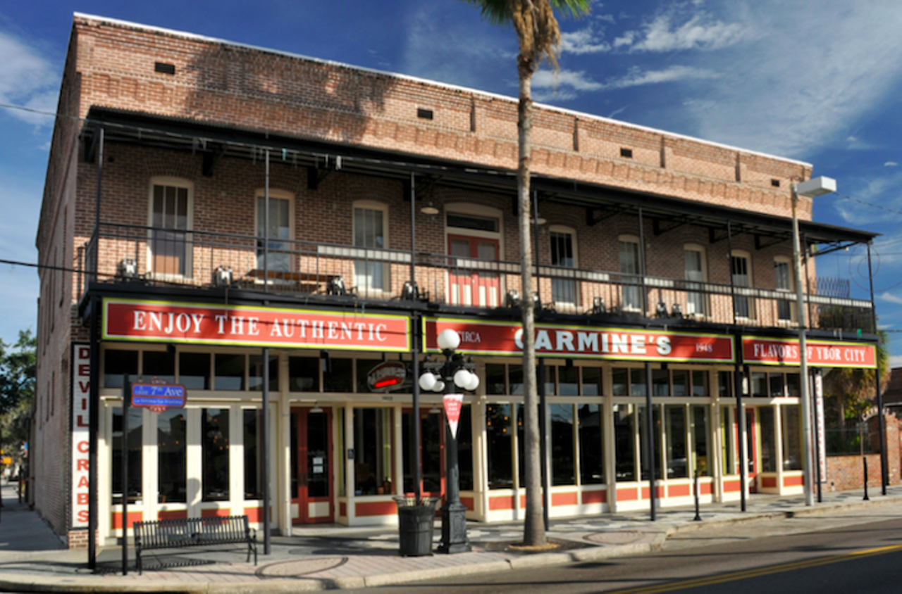 Carmine&#146;s
1802 E. 7th Ave., Ybor City
Carmine&#146;s began as a Italian and pizza stop in 1945 at Highland Avenue and Martin Luther King Jr. Boulevard. For 16 years, Carmine Iavarone&#146;s grandparents served the city its first pizza slices. Then, in 1961, Iavarone bought the Seaborg Cafeteria in Ybor and sold 99-cent breakfasts to cigar and box factory workers. At the time though, Columbia was the only restaurant that served dinner in Ybor. Carmine sought to change that. Finally, he opened Carmine&#146;s Restaurant and Bar at the corner of the main strip and 19th Street. Eight years later, the restaurant moved to its current location. Carmine told the Tampa Magazine that the restaurant initiated Ybor nightlife. Carmine&#146;s is known for its deviled crabs and pressed Cuban sandwiches.
Photo via Carmine&#146;s/Google Gallery