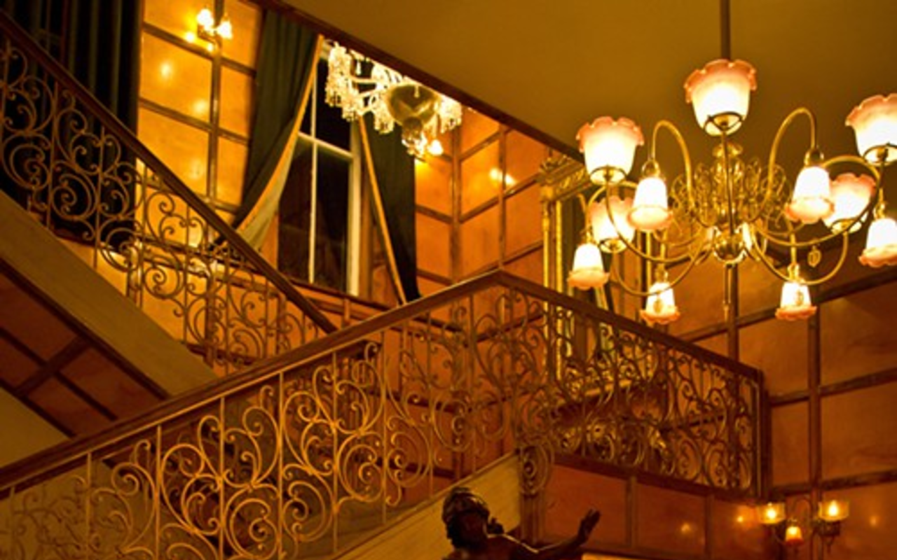 The grand salon staircase of the Don Vicente Ybor Inn, formerly the Gonzales Medical Clinic