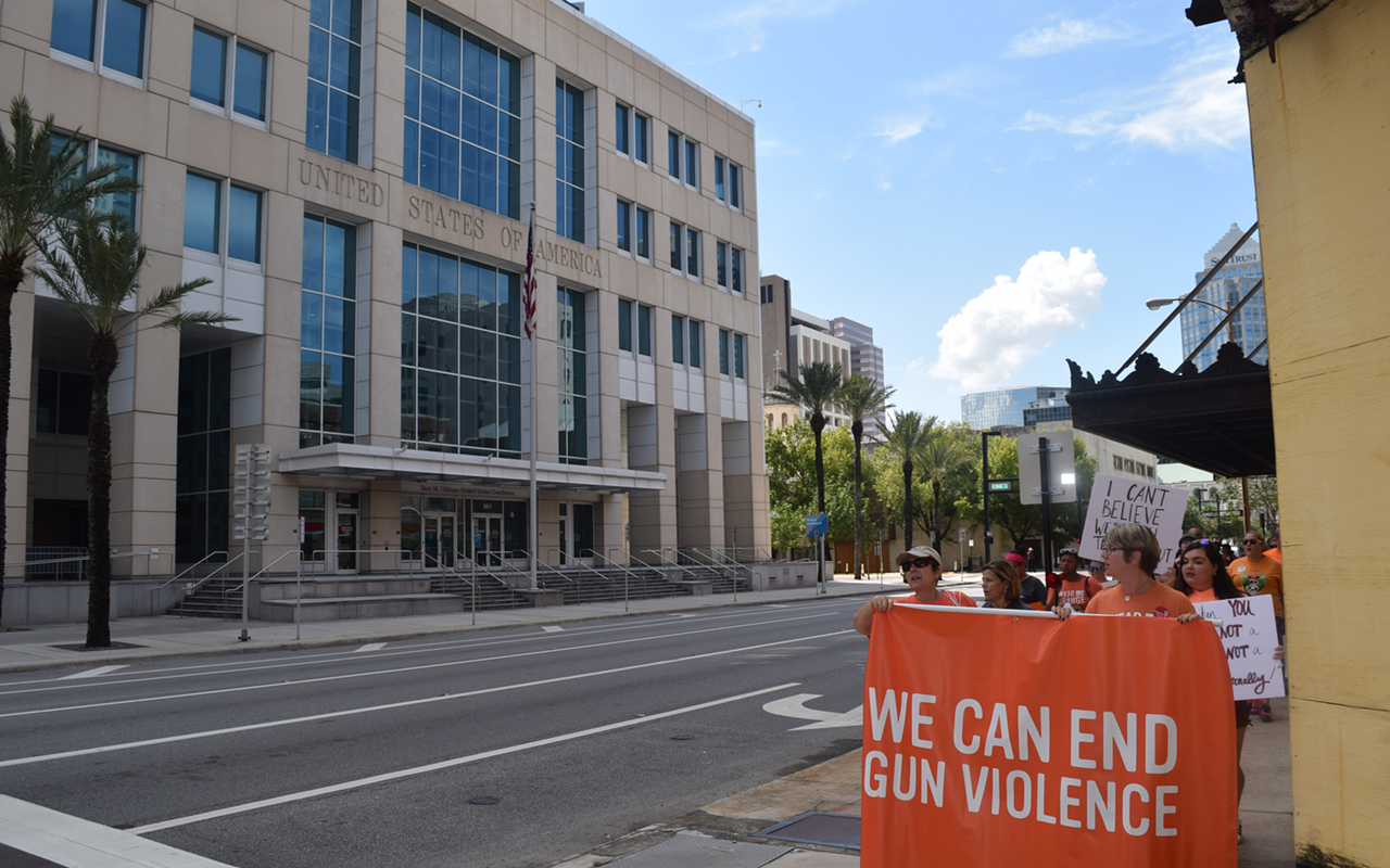Activists gather to protest controversial NRA ad in downtown Tampa