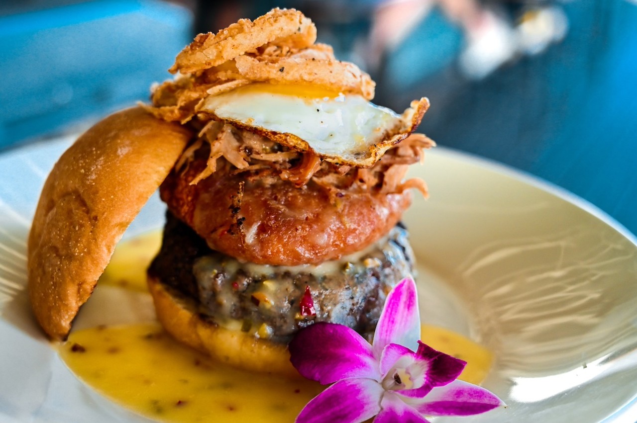 
Hula Bay
5210 W Tyson Ave., Tampa
Big Hangover: Burger topped with fried pepper jack mac and cheese, pepper jack cheese sauce, pulled pork, an egg and onion straws. ($18)
Photo courtesy of Hula Bay