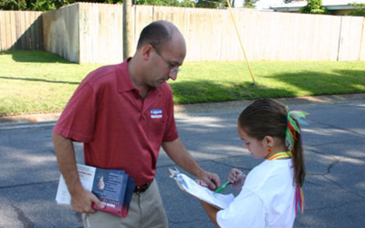 ALL IN THE FAMILY: Angelo Cappelli and daughter Anna take a break during door-to-door canvassing in St. Pete.