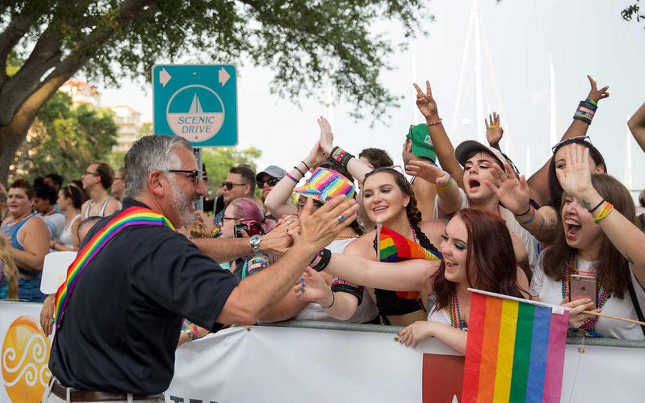 Mayor Rick Kriseman greets parade goers in St. Petersburg, Florida on June 25, 2018.