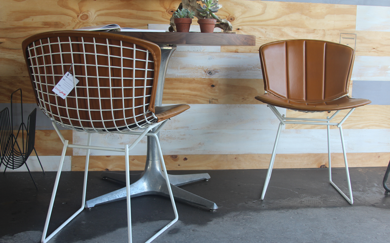 PARK IT HERE: Two chairs sourced by Chris Kelly with leather slips.