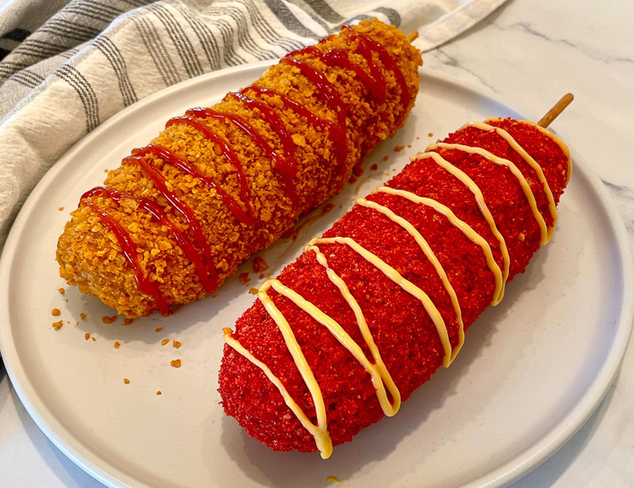 SPICY KOREAN CORNDOG
Hot dog, dipped in buttermilk batter, layered with cheese, and rolled in crushed spicy hot Cheetos. 
Seivers Smokehouse Grill
