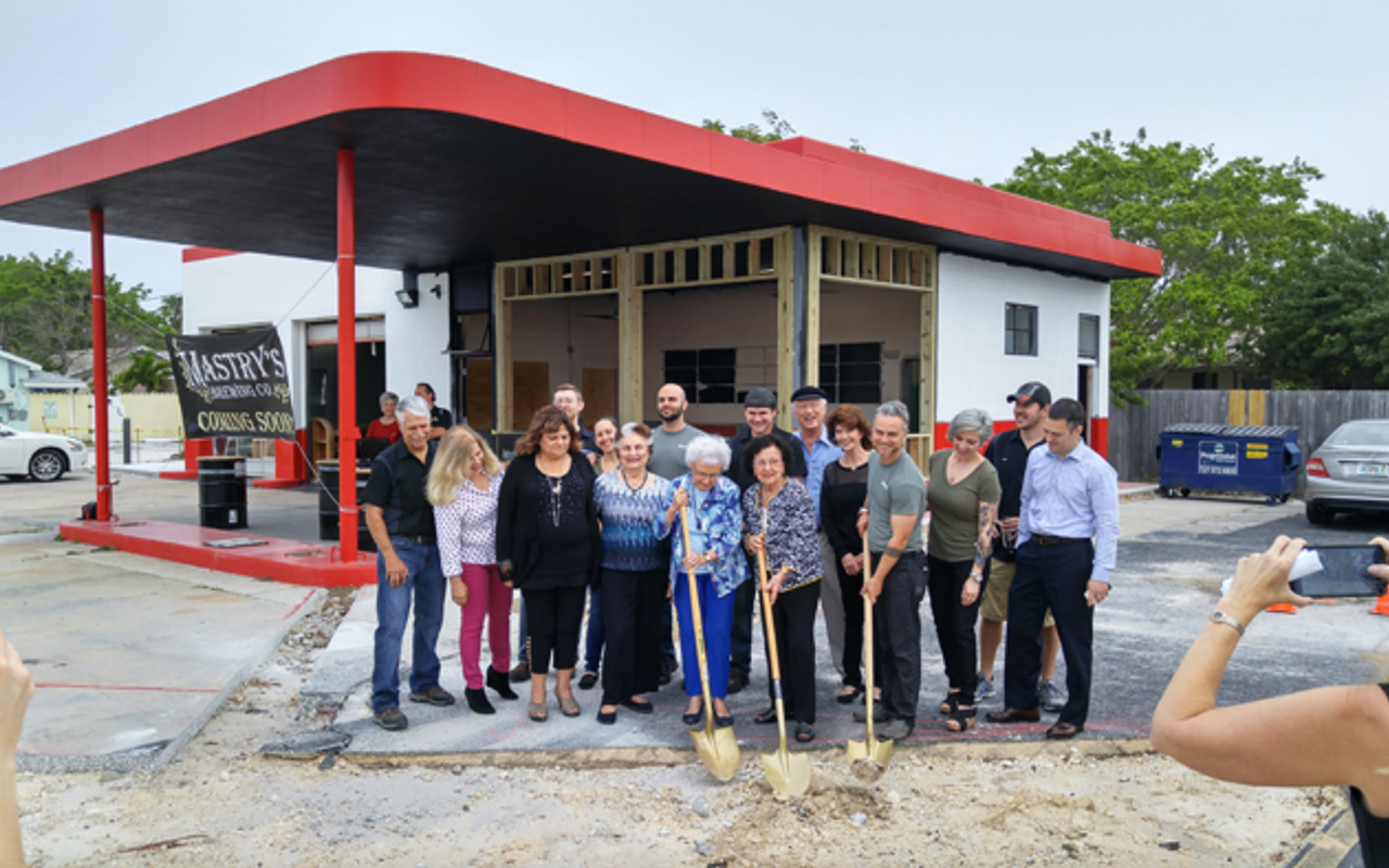 Joined by other members of the Mastry family, Marguerite Mastry Dawson, Juliet Mastry Miller and Matthew Dahm make the new brewery's first official dig.