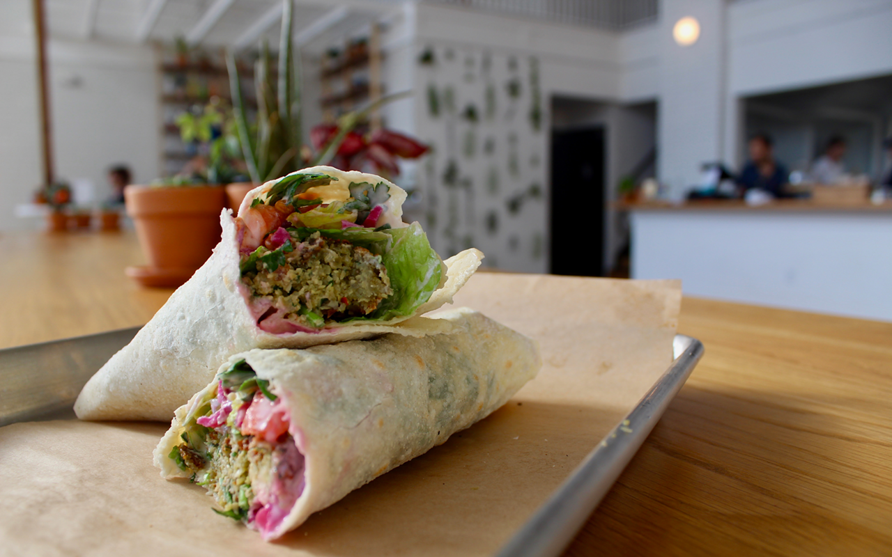 Falafel saj is filled with crispy chickpea and fava bean croquette, tomato, picked beets and tahini.