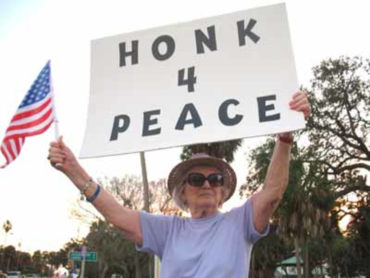 Carolyn Hammond demonstrates during the Dunedin Peace Cornering.
