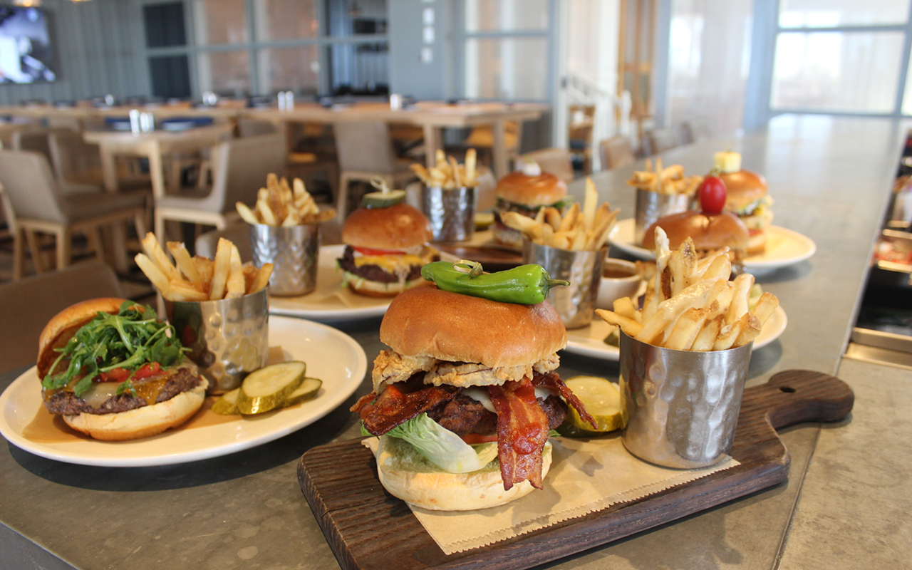 Front and center is Don CeSar burger Rowe Your Boat (Wagyu, white Cheddar, Sriracha bacon, bibb lettuce, tomato, crispy onion), among the resort's Burger Month specials.