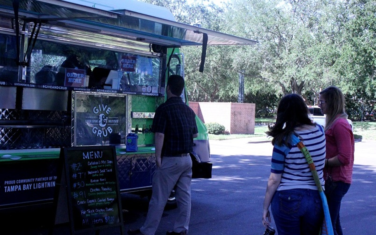The Give & Grub food truck serves lunch in St. Petersburg's Carillon area.