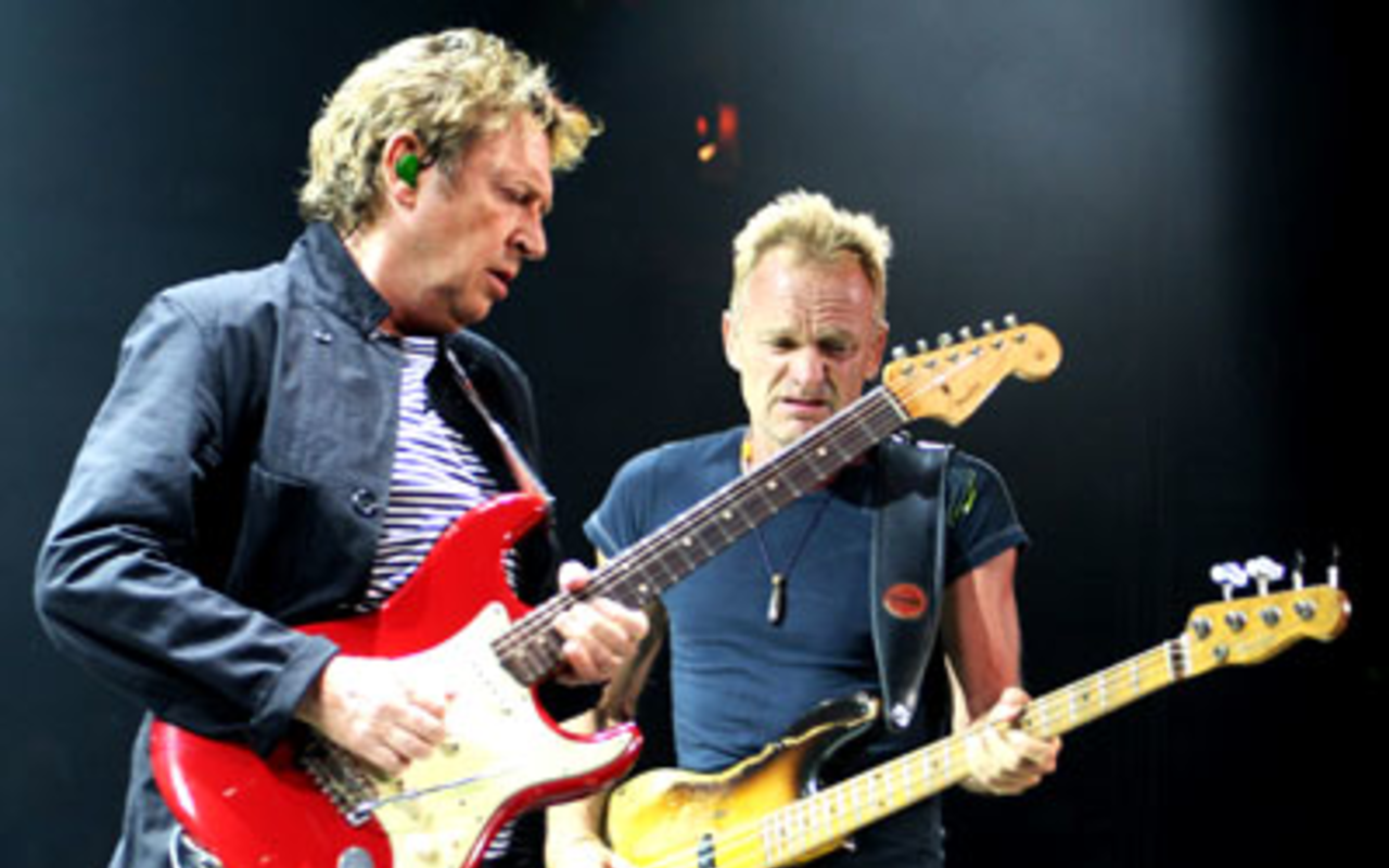 FEELING THEIR AGE: Andy Summer and Sting grind it out at the St. Pete Times Forum.
