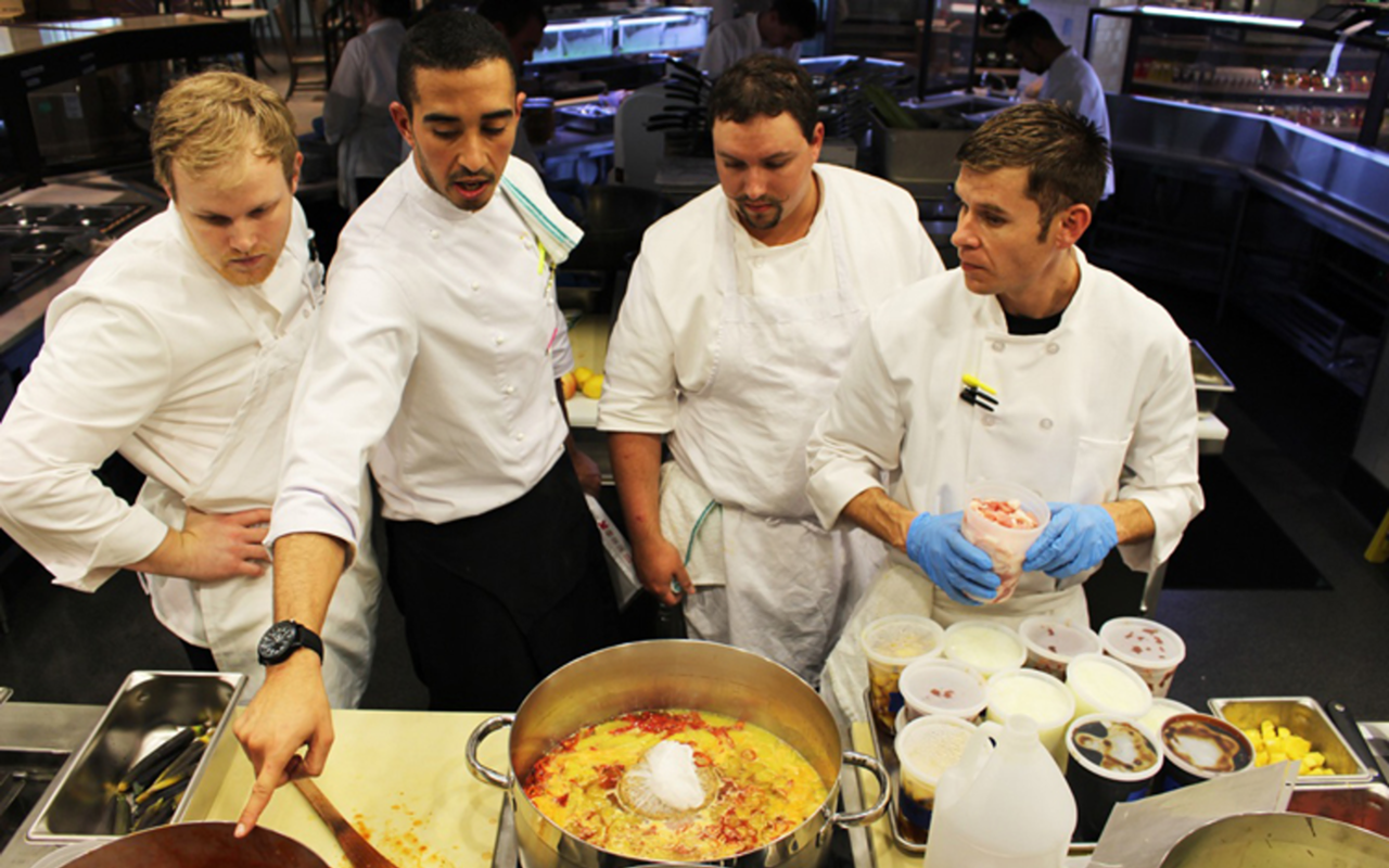 SEAFOOD-FARERS: Sous chef Jalal Bellekat, second from left, teaches From the Sea kitchen staffers how to craft a sauce.