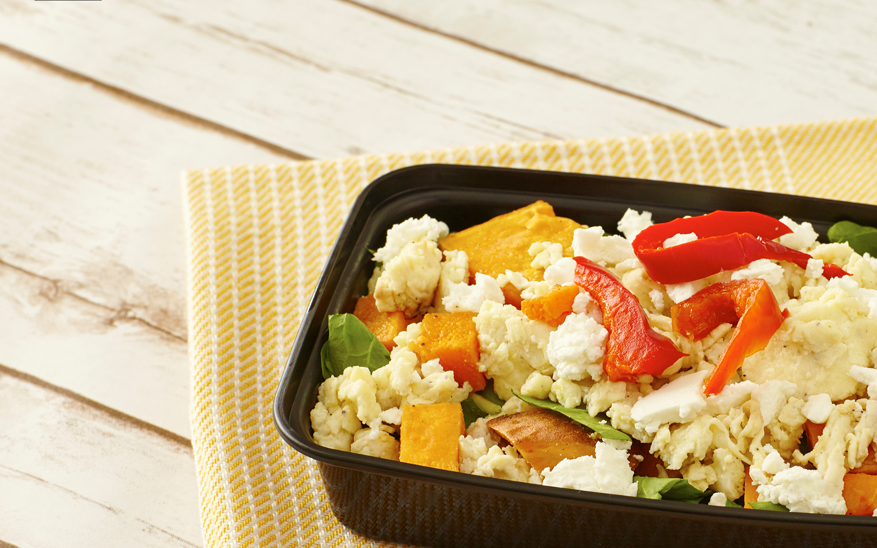 Farmhouse scramble — eggs, roasted sweet potatoes, butternut squash, baby spinach, goat cheese and red peppers.