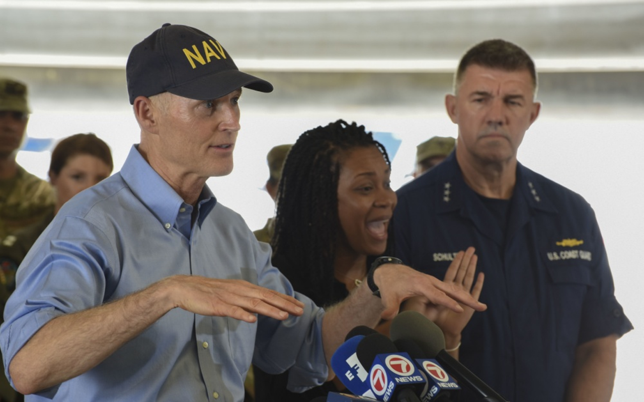 Florida Governor, Rick Scott, speaks with media during a press conference at Coast Guard Air Station Miami in Opa Locka, Fla., Sept. 11, 2017.