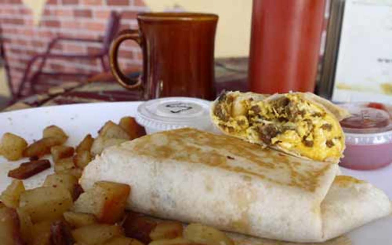 Foxy's breakfast burrito special is tasty, but better when slathered with the restaurant's classic wing sauce.