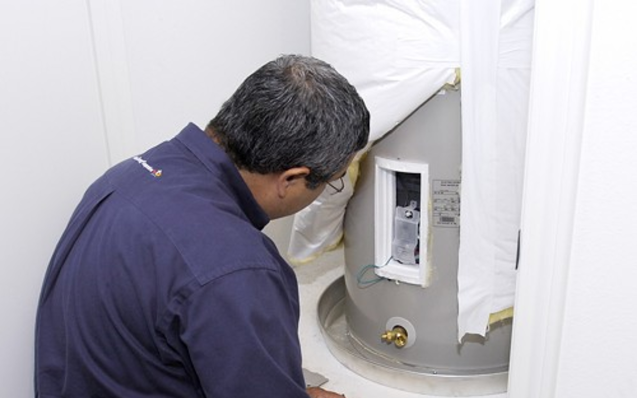 Companies offering energy audits are generally reputable and legitimate and will help you both save money and reduce your carbon footprint if you follow their advice. Pictured: A home energy auditor inspects a hot water heater.
