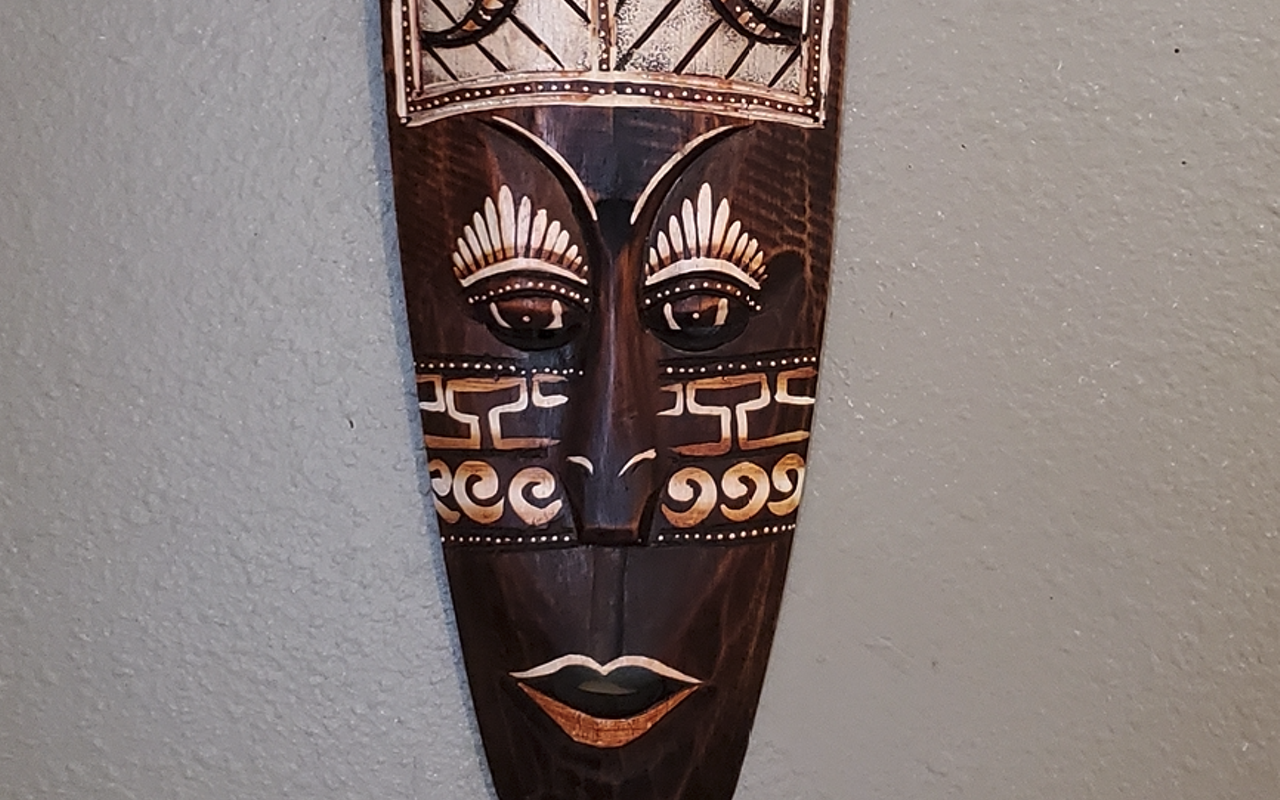 An African mask owned by Tampa poet Negasi.