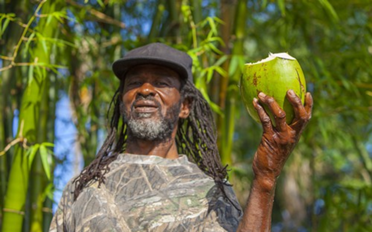 Jamaica native Cephas Gilbert harvests fresh coconut daily to share with family, friends and customers at Cephas' Jamaican Hot Shop in Ybor City.