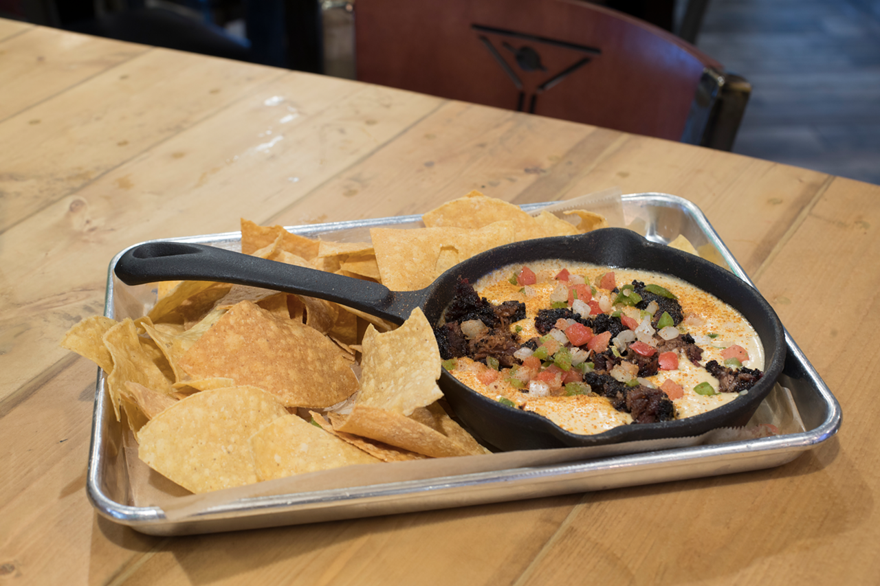 The burnt ends queso's five-cheese sauce is a creamy and delightful amalgam with the mound of fresh tortilla chips.