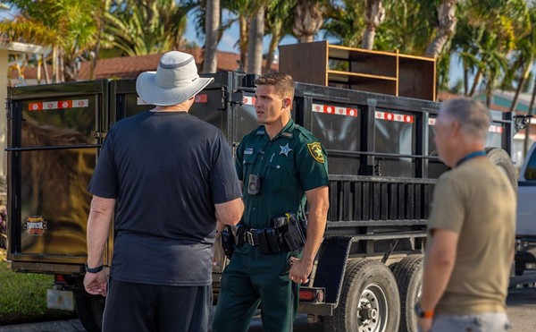 A Pinellas sheriff officer speaking to residents.