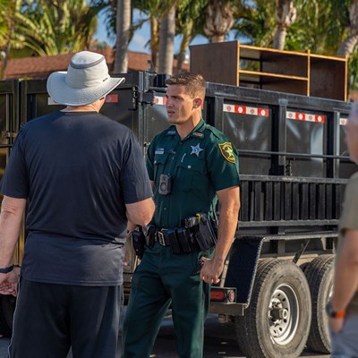 A Pinellas sheriff officer speaking to residents.