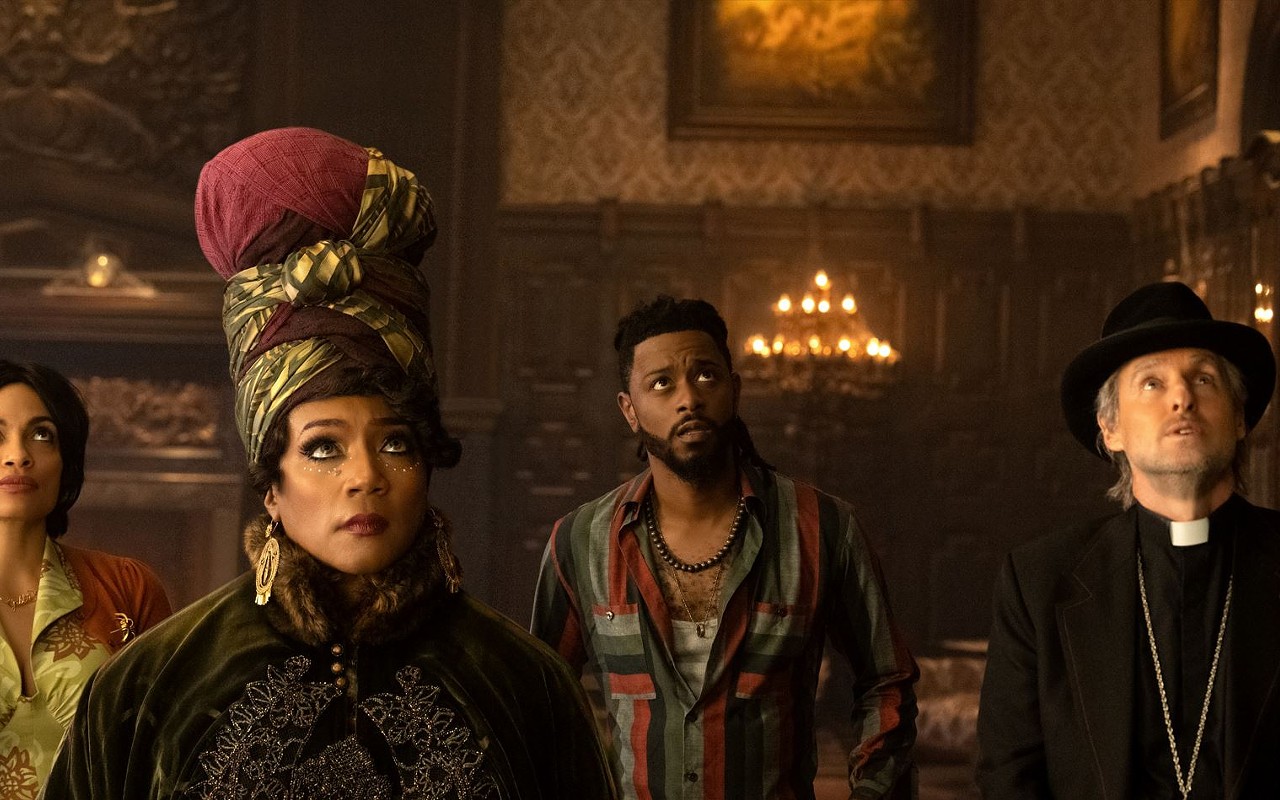 (L-R) Rosario Dawson, Tiffany Haddish, LaKeith Stanfield and Owen Wilson gaze up at the 'Haunted Mansion,' or maybe to whatever god or goddess they worship, or even to their agent(s), anyone who can explain how such funny, talented people ended up in such a terrible movie.