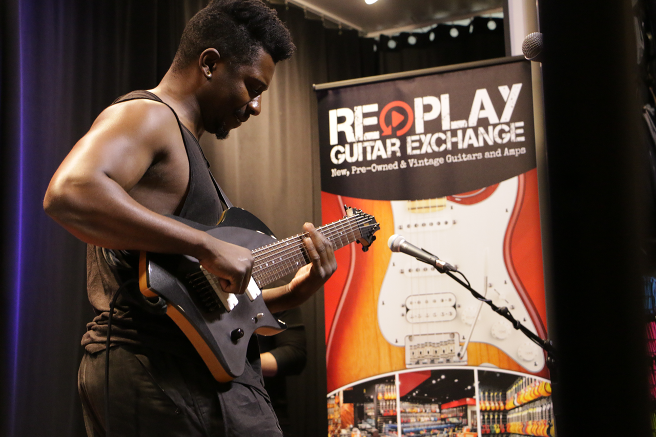 Tosin Abasi at Replay Guitar Exchange in Tampa, Florida on May 22, 2017.