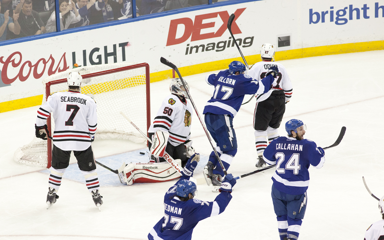 Hedman, Callhan, and Killorn celebrate as the puck bounces out of the Blackhawks' net on what was ultimately Garrison's game-winning goal.