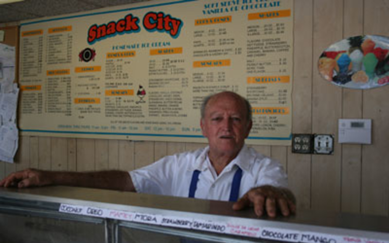 ICE CREAM MAN: Alfredo Naranjo poses behind his case of more than 40 flavors of ice cream.