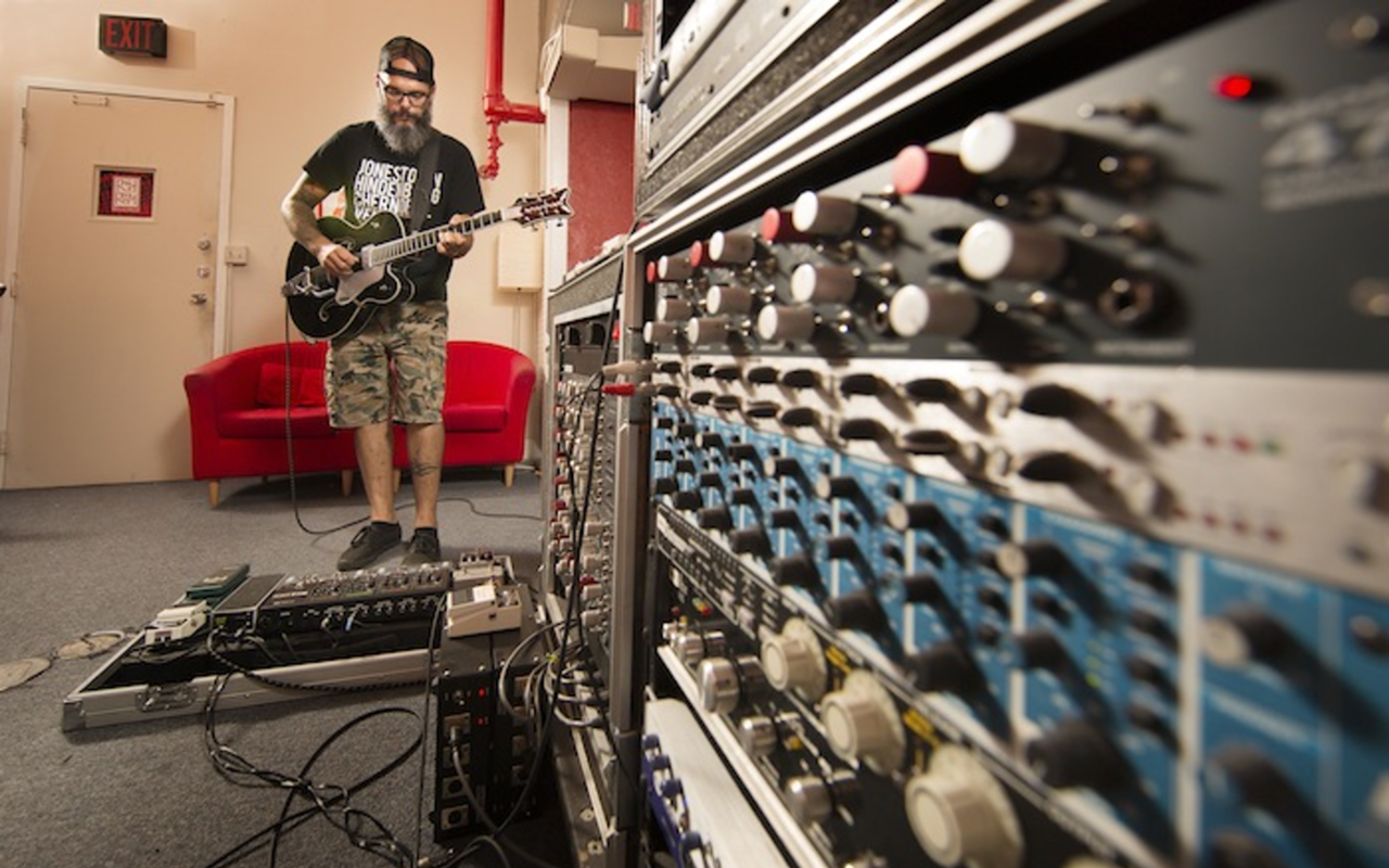 Jason Trunzo of Black Coast Royals lays down a track at Ybor's Red Room Recorders.