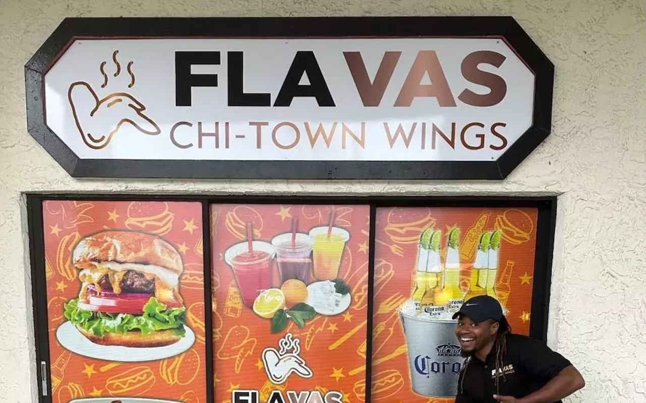 Co-owner Jacques Brooks poses in front of his newly-opened restaurant.