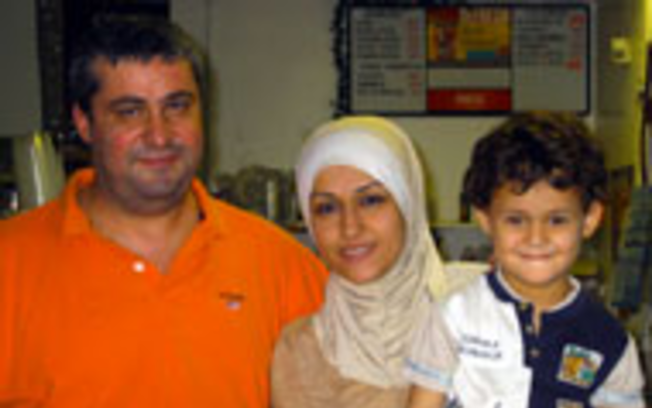 CULINARY AMBASSADORS: Nabil and Wajiha 
    Chehab with their son Omran at Cedar Market.