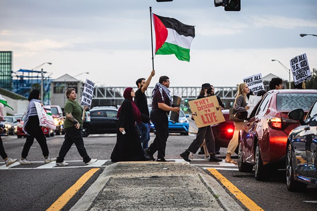 Activists in the intersection of 56th Street and Fowler Avenue near Tampa, Florida on Feb. 12, 2024.