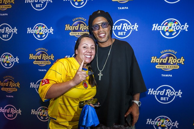 Ronaldinho (R) with a fan at Seminole Hard Rock Hotel & Casino in Tampa, Florida on July 10, 2024.