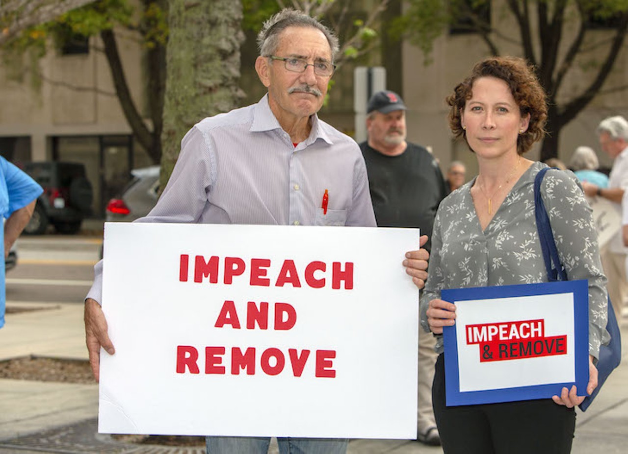 Photos from Tampa's 'Nobody's Above The Law' rally calling for Trump's impeachment