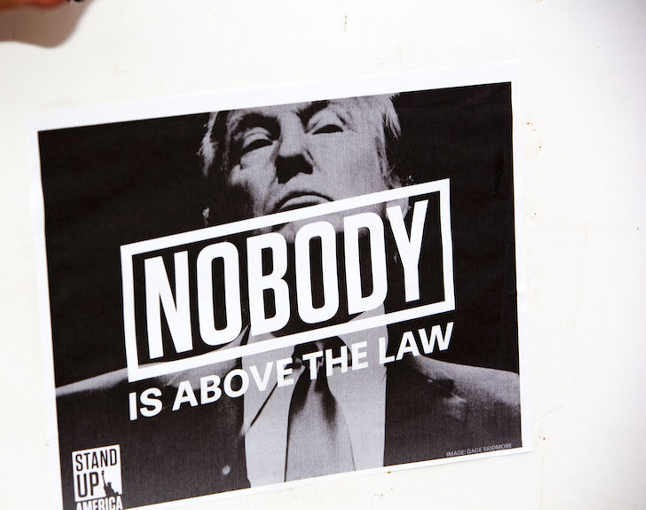 Photos from Tampa's 'Nobody's Above The Law' rally calling for Trump's impeachment
