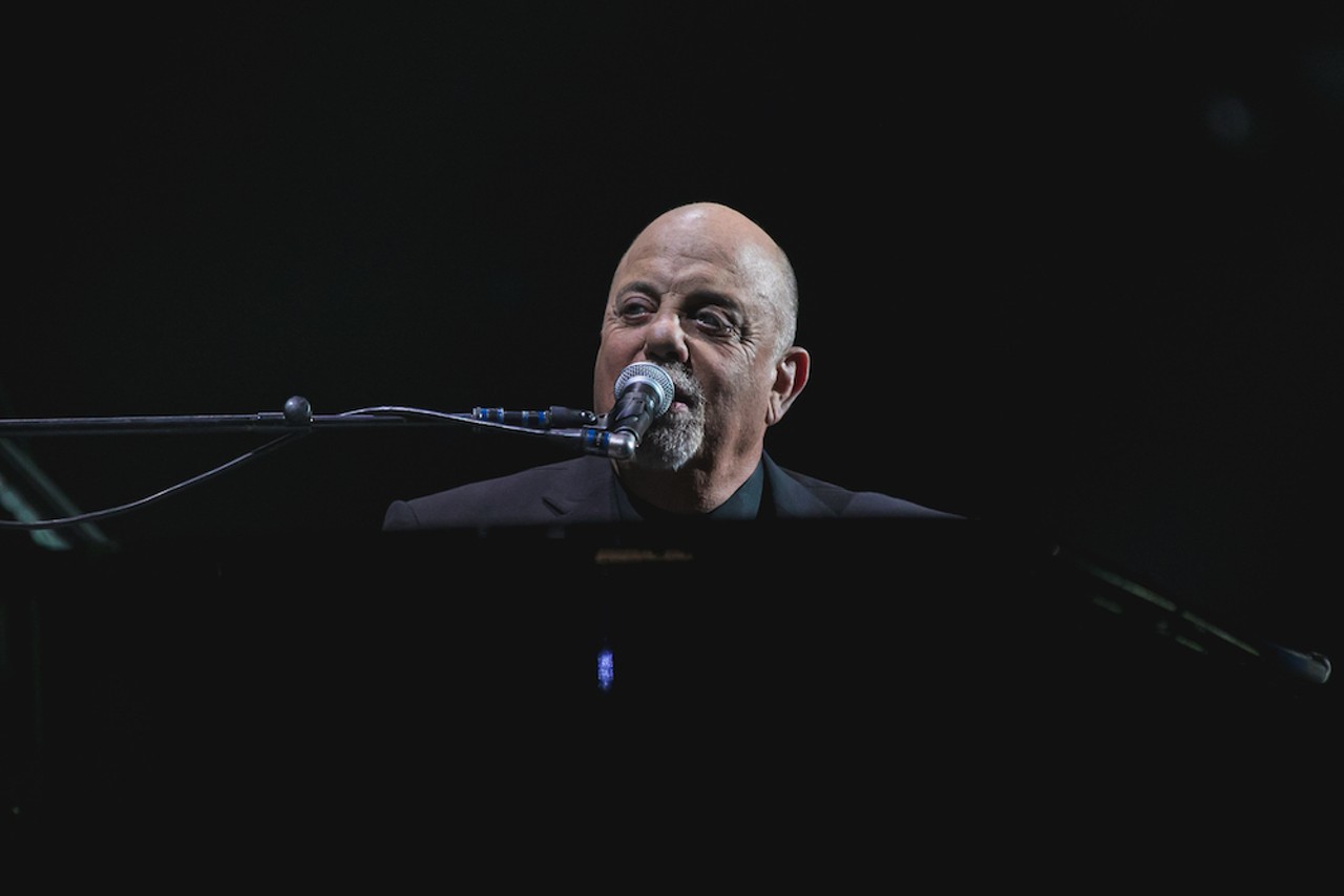 Photos of Billy Joel playing guitar (and piano) at Tampa's Amalie Arena