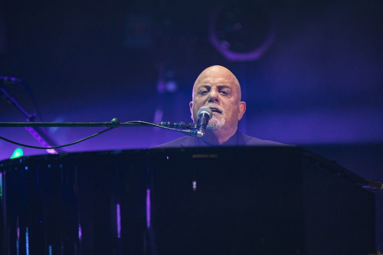 Photos of Billy Joel playing guitar (and piano) at Tampa's Amalie Arena