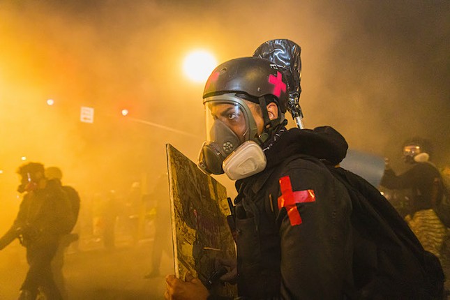Photos of Portland protesters facing off with federal storm troopers