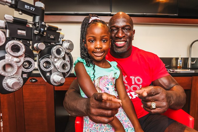 Photos: WWE superstar Titus O'Neil gives Tampa kids more than 30,000 backpacks at 'Back To School Bash'