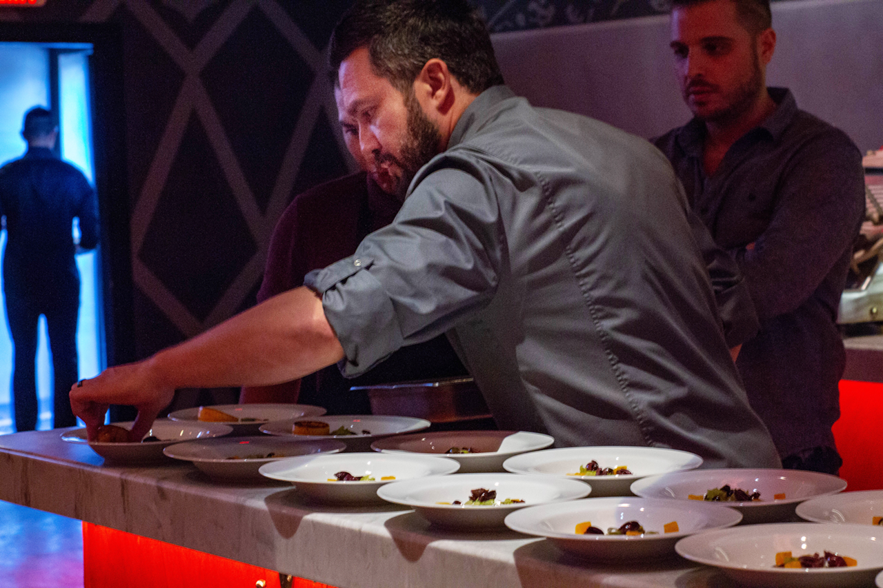 In addition to explaining each dish, the celebrity chef and restaurateur helped plate the six-course spread.