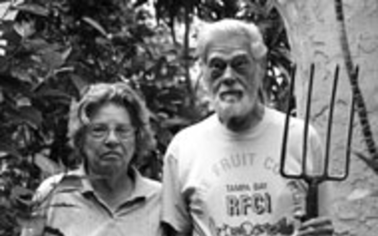 UNCOMMON HORTICULTURISTS: Theresa and Bob 
    Heath in  their garden.