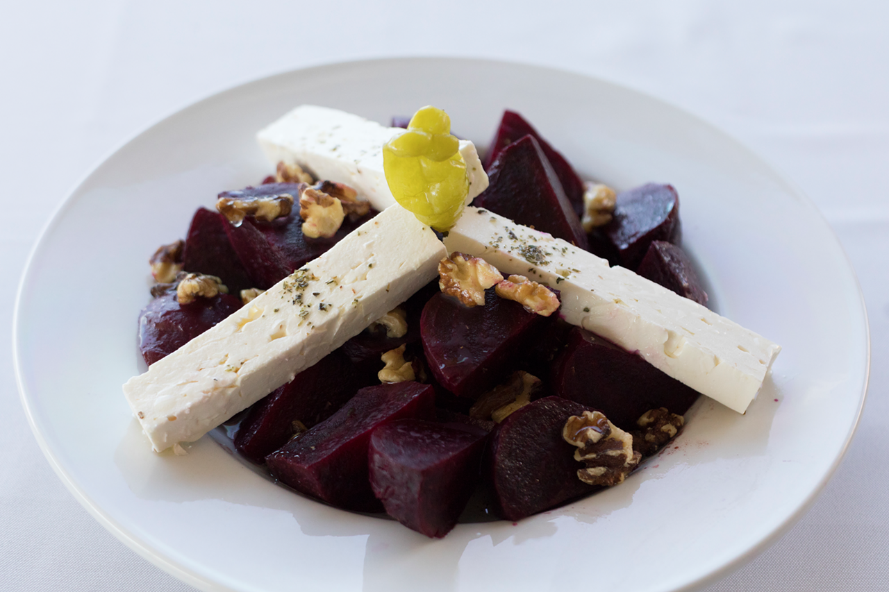 Roasted beets tossed with feta, walnuts, extra-virgin olive oil and aged balsamic vinegar make up the beet salad.