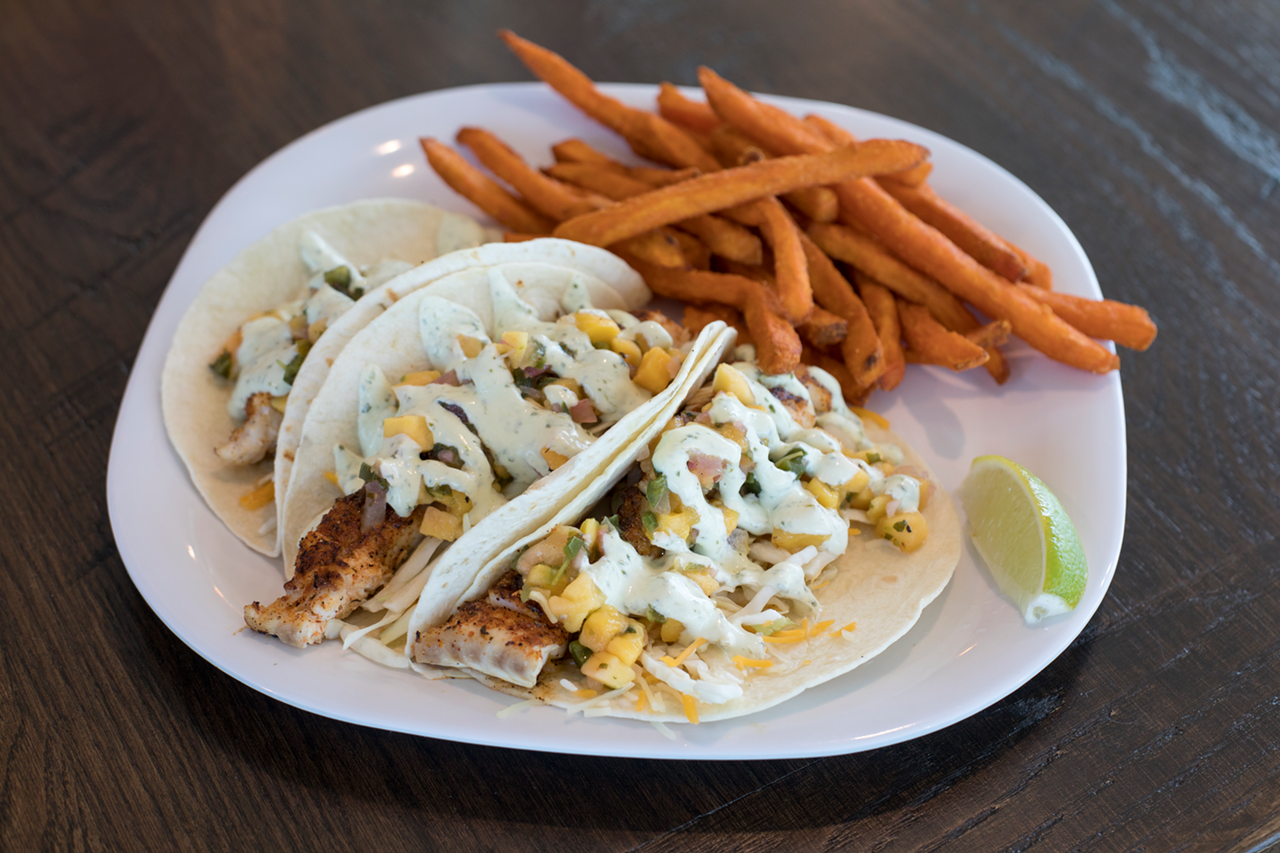 Crabby's is taking mahi mahi off the menu, but these grouper tacos are presented with crispy sweet potato fries.