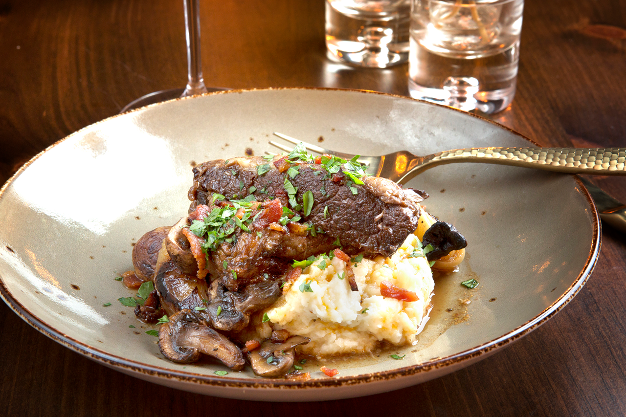 Braised and boneless, the short ribs entree consists of celery root, cipollini onions, bacon and mushrooms.
