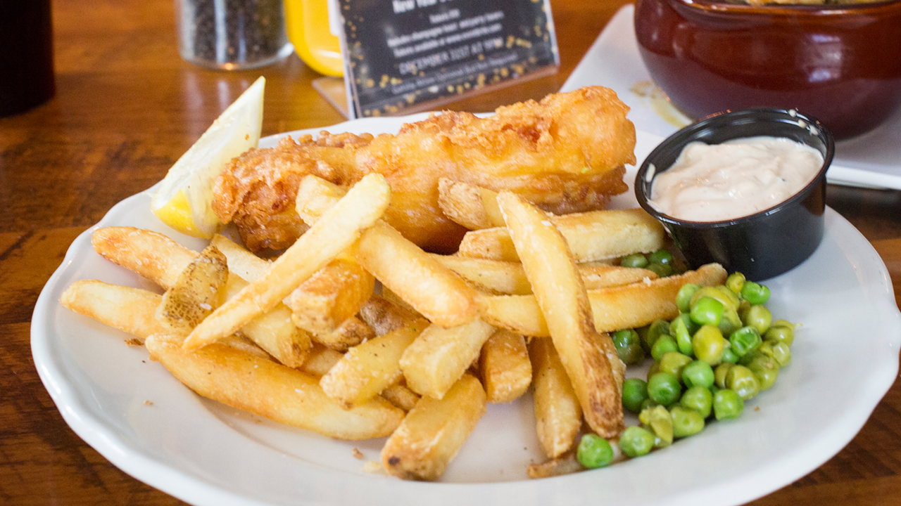 Beer-battered Atlantic cod, part of London Heights British Pub's fish and chips entree, is quite authentic.