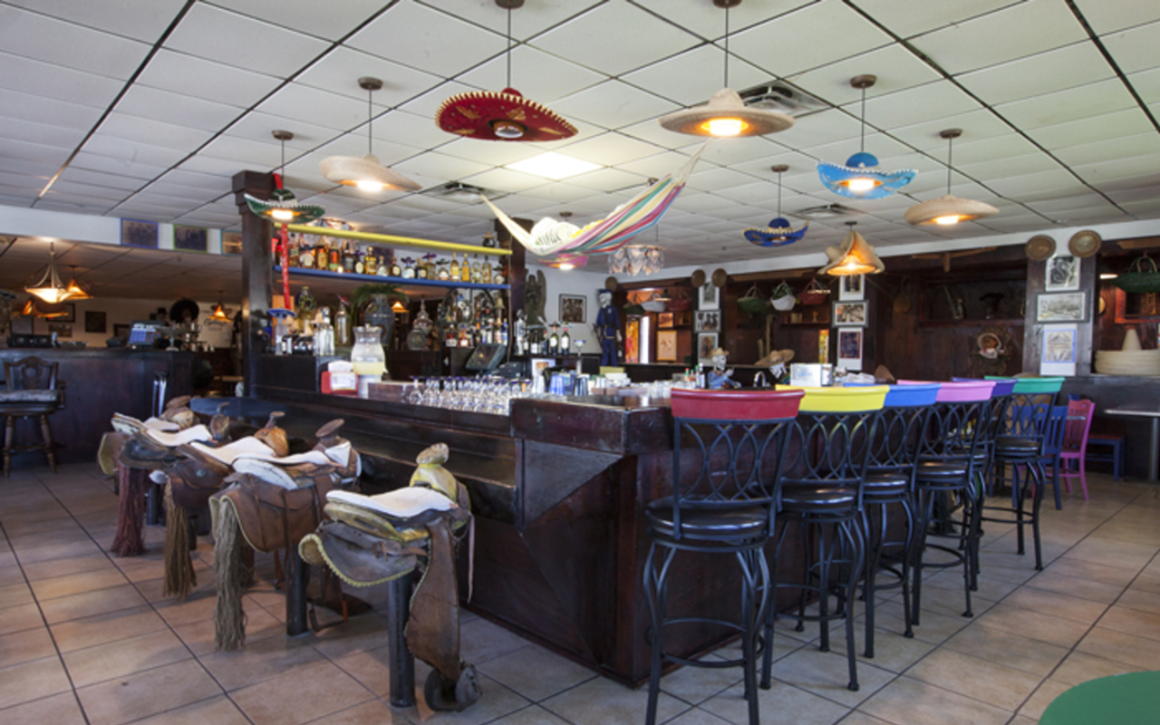 Pericos' inviting interior includes sombrero lamps and saddled-up bar stools.